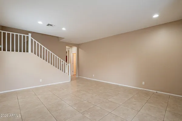 a view of an empty room with stairs