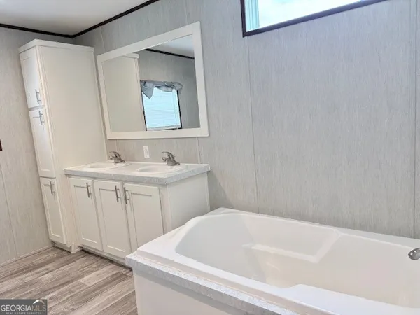 a bathroom with a sink and a bathtub
