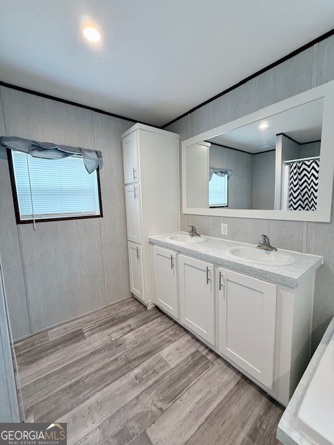 683 Evergreen Church Road Cobbtown, GA 30420 - Photo 15 of 32 a spacious bathroom with a double vanity sink and a mirror