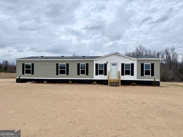 683 Evergreen Church Road Cobbtown, GA 30420 - Photo 26 of 32 a front view of a house with a yard