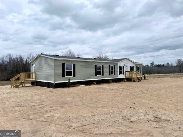 683 Evergreen Church Road Cobbtown, GA 30420 - Photo 28 of 32 a front view of a house with a yard