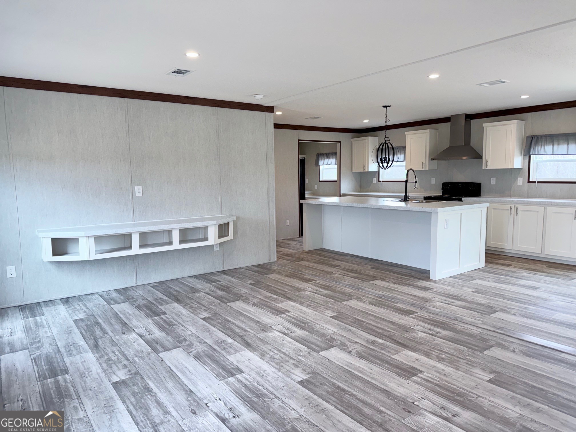 683 Evergreen Church Road Cobbtown, GA 30420 - Photo 4 of 32 a kitchen with stainless steel appliances a refrigerator and a stove top oven