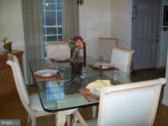 15108 Middlegate Road Silver Spring, MD 20905 - Photo 3 of 9 a table and chairs in a room