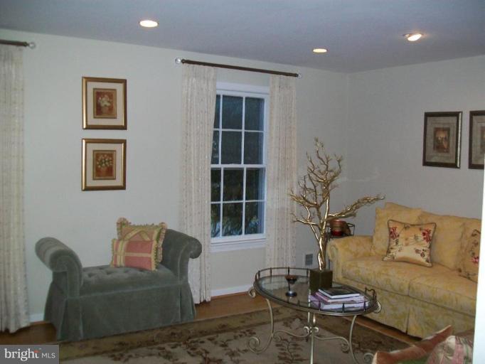 15108 Middlegate Road Silver Spring, MD 20905 - Photo 7 of 9 a living room with furniture and a window