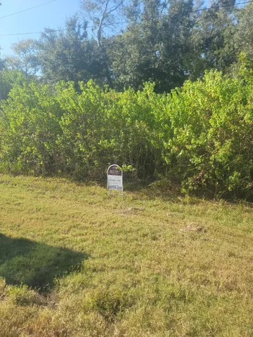 a view of a lake with a yard