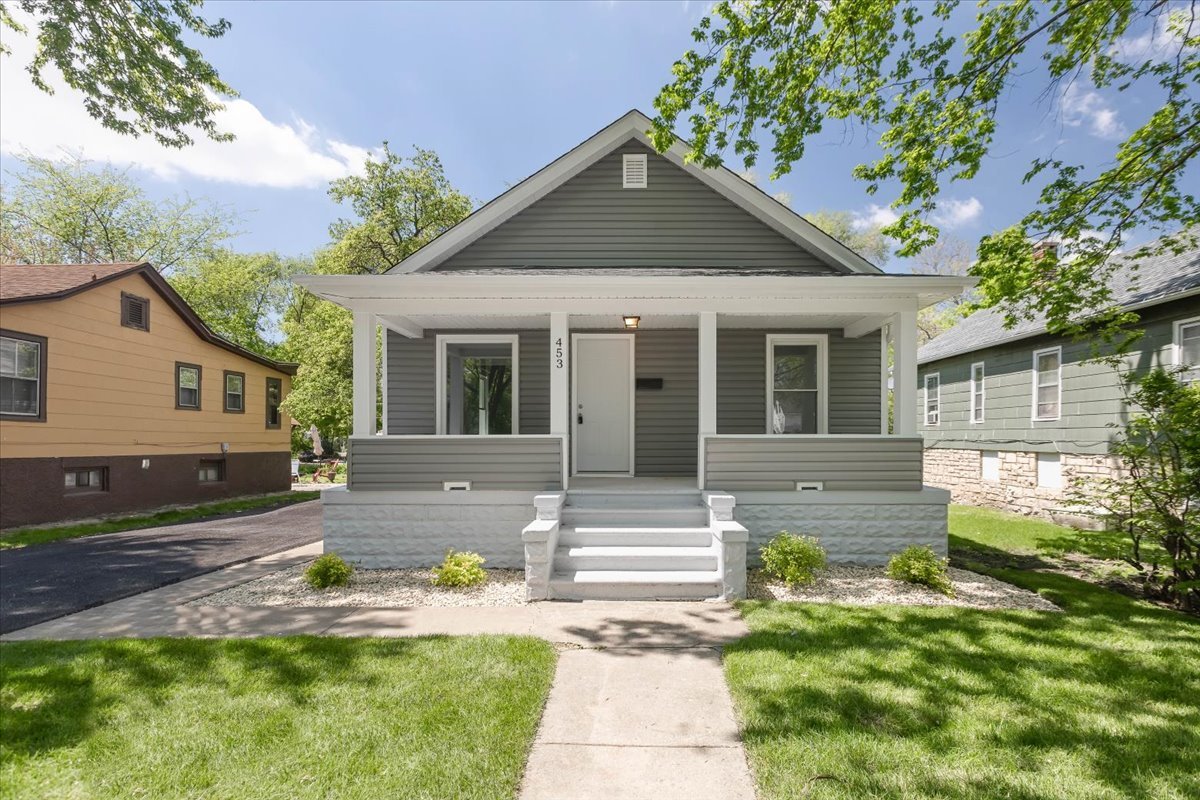 453 Water Street Joliet, IL 60436 - Photo 1 of 14 a front view of a house with a yard