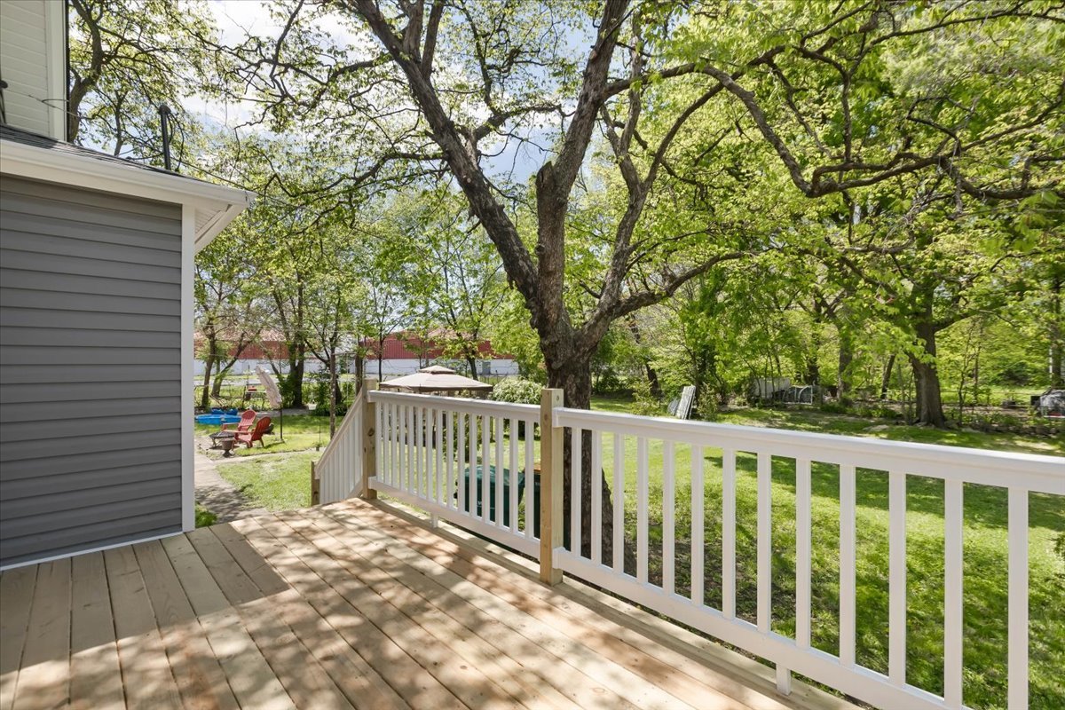 453 Water Street Joliet, IL 60436 - Photo 12 of 14 a view of a wooden fence and trees