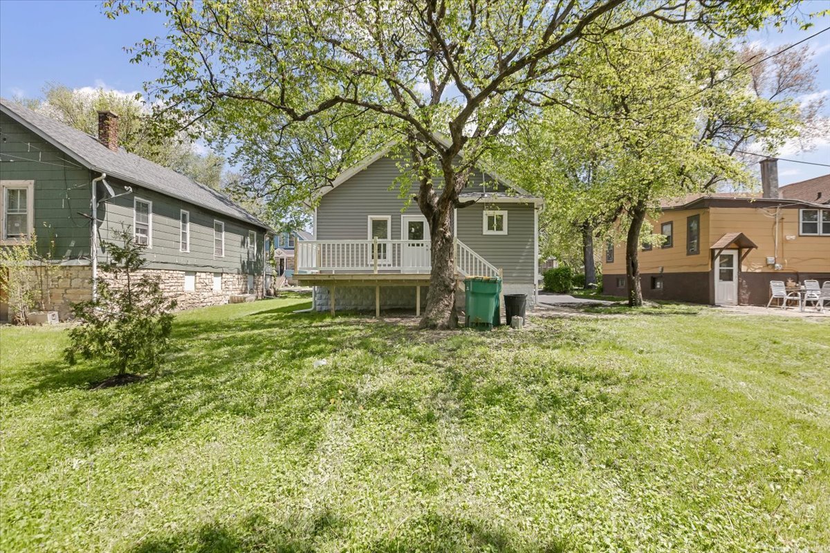 453 Water Street Joliet, IL 60436 - Photo 14 of 14 a front view of a house with a garden and trees
