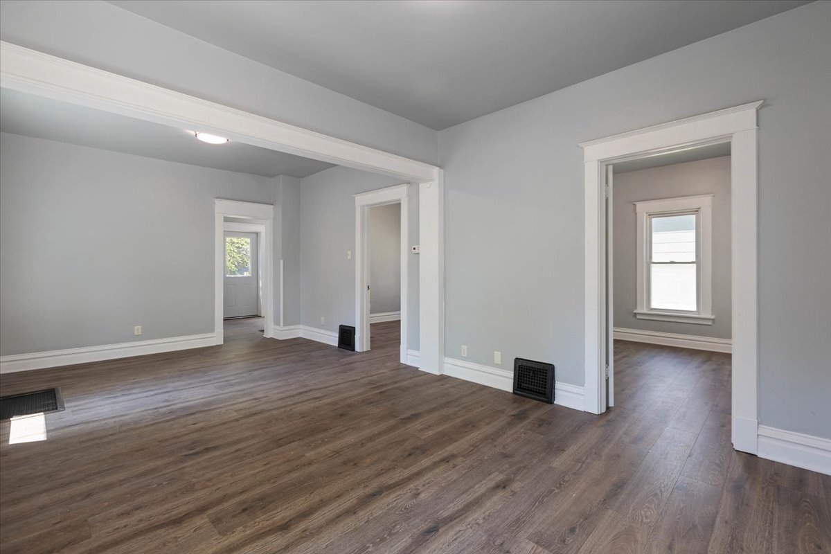 453 Water Street Joliet, IL 60436 - Photo 6 of 14 a view of empty room with wooden floor and fan