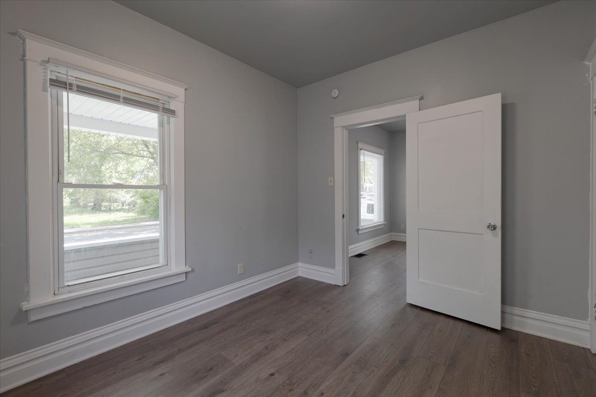 453 Water Street Joliet, IL 60436 - Photo 7 of 14 a view of a room with wooden floor and window