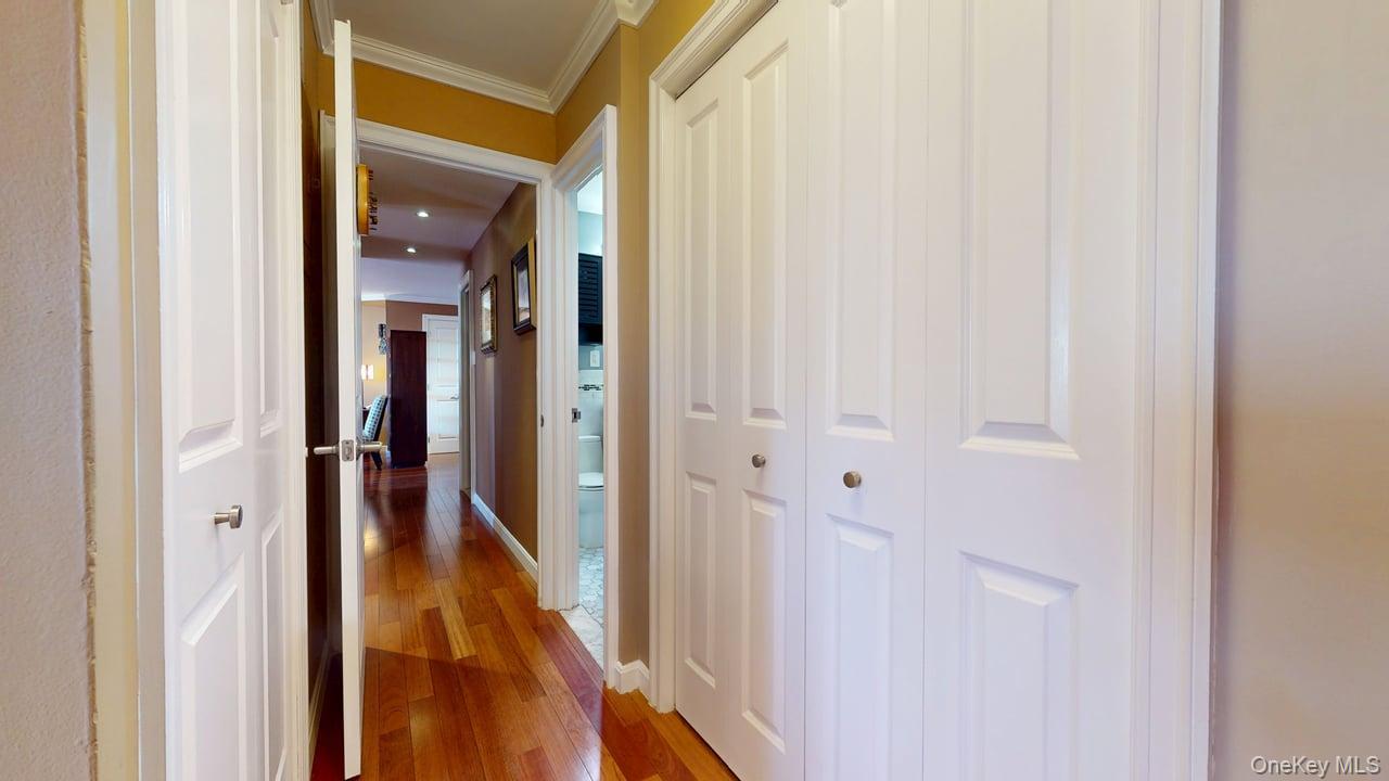 118-17 Union Turnpike, Unit 5H Queens, NY 11375 - Photo 24 of 48 a view of a hallway with a wooden door