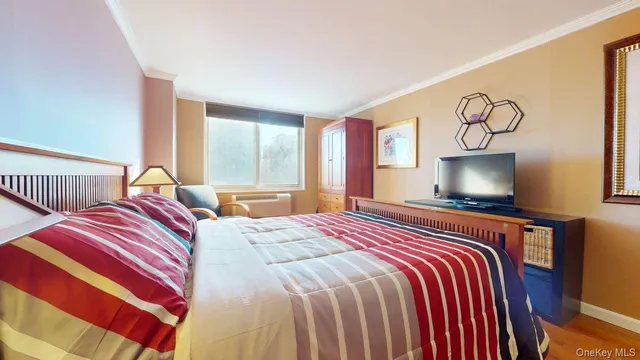 a bedroom with double bed and a window