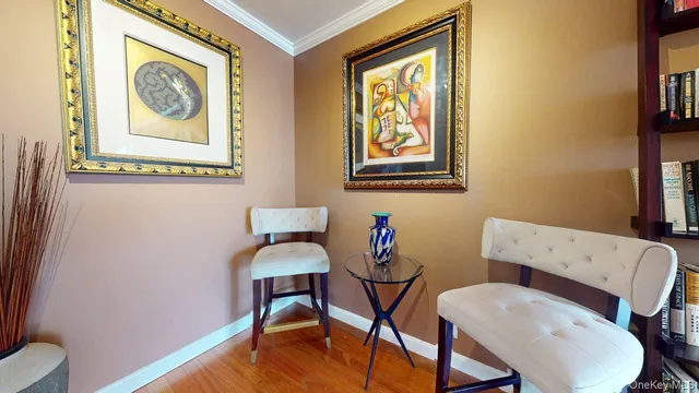 a view of a workspace room with furniture and wooden floor