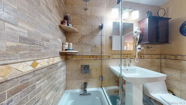 a bathroom with a sink and mirror