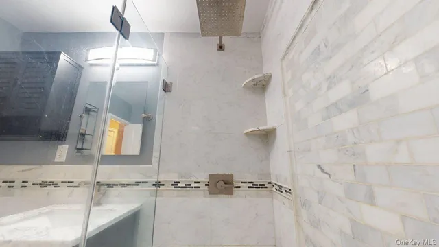 a bathroom with a sink and mirror