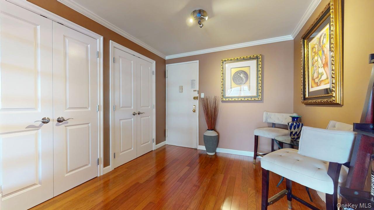 118-17 Union Turnpike, Unit 5H Queens, NY 11375 - Photo 4 of 48 a view of room with furniture and wooden floor