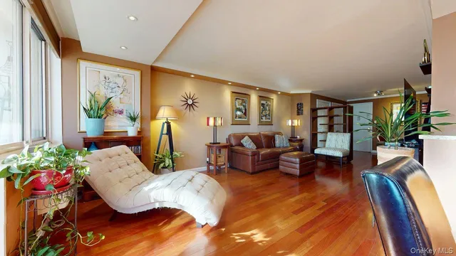 a living room with furniture fireplace and flat screen tv