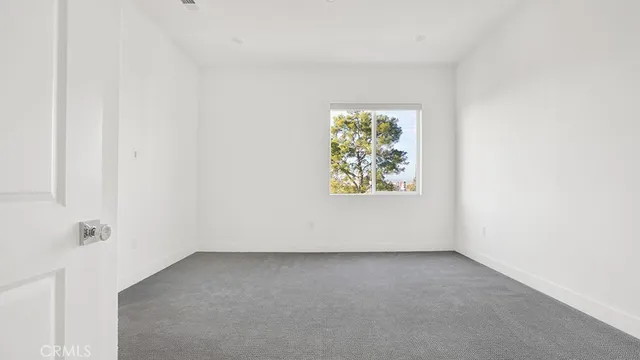 a kitchen with stainless steel appliances kitchen island a table chairs refrigerator and sink