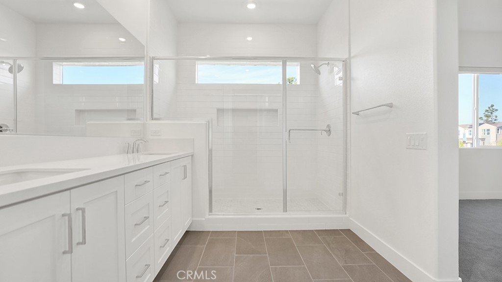 401 Junco Irvine, CA 92618 - Photo 23 of 40 a bathroom with a shower and a tub