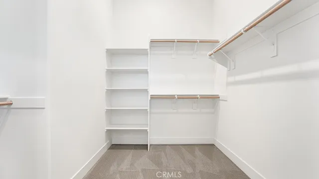 a bathroom with a granite countertop sink toilet and a mirror
