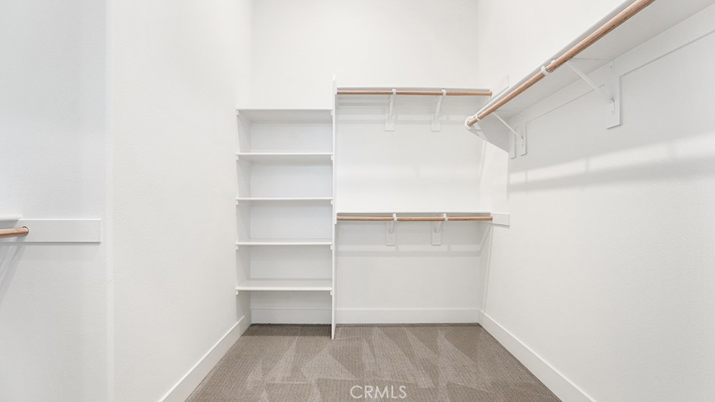 401 Junco Irvine, CA 92618 - Photo 25 of 40 a view of walk in closet with empty racks