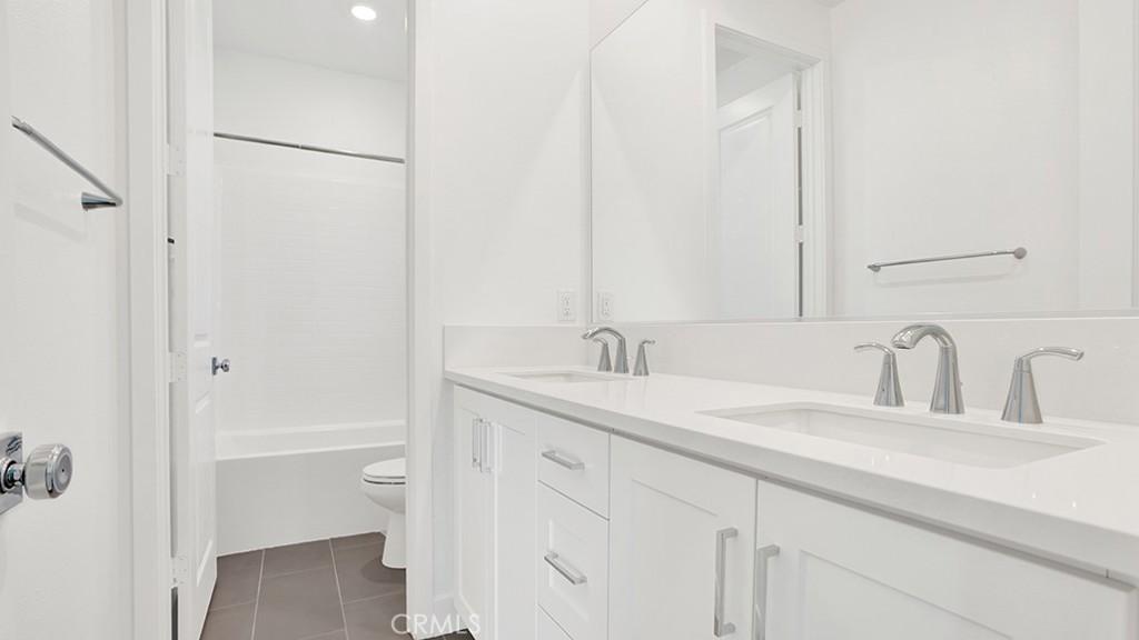401 Junco Irvine, CA 92618 - Photo 29 of 40 a bathroom with a sink and a mirror