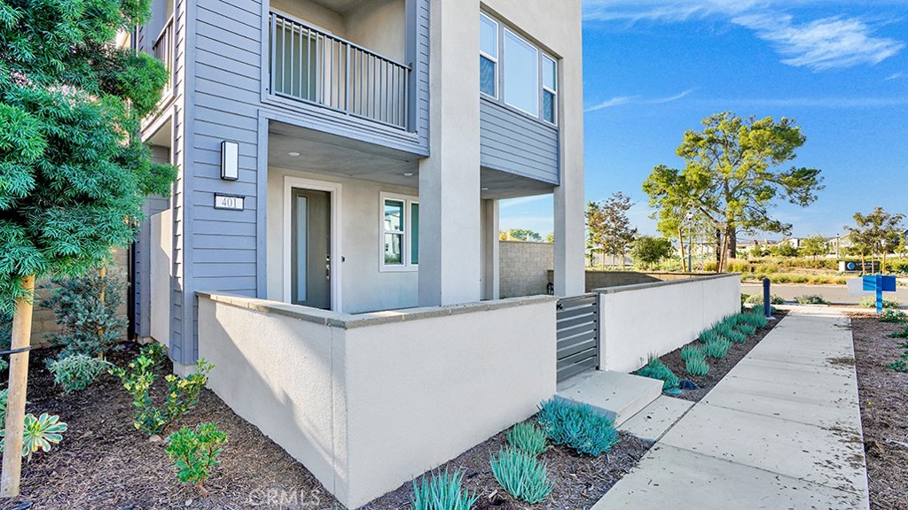 401 Junco Irvine, CA 92618 - Photo 6 of 40 a view of a brick house with a large windows