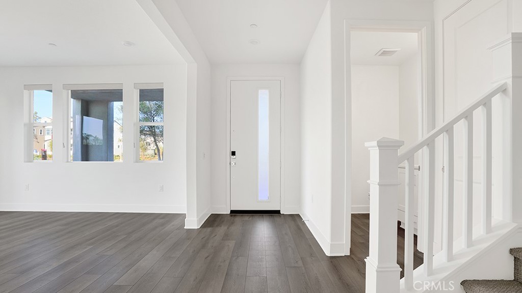 401 Junco Irvine, CA 92618 - Photo 8 of 40 a view of a hallway with wooden floor