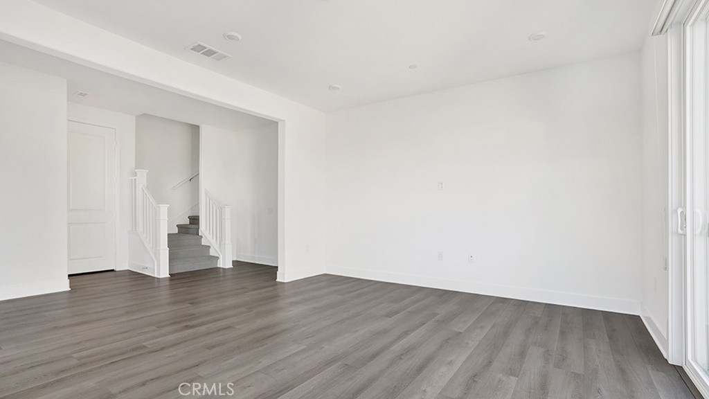 401 Junco Irvine, CA 92618 - Photo 10 of 40 a view of an empty room with wooden floor