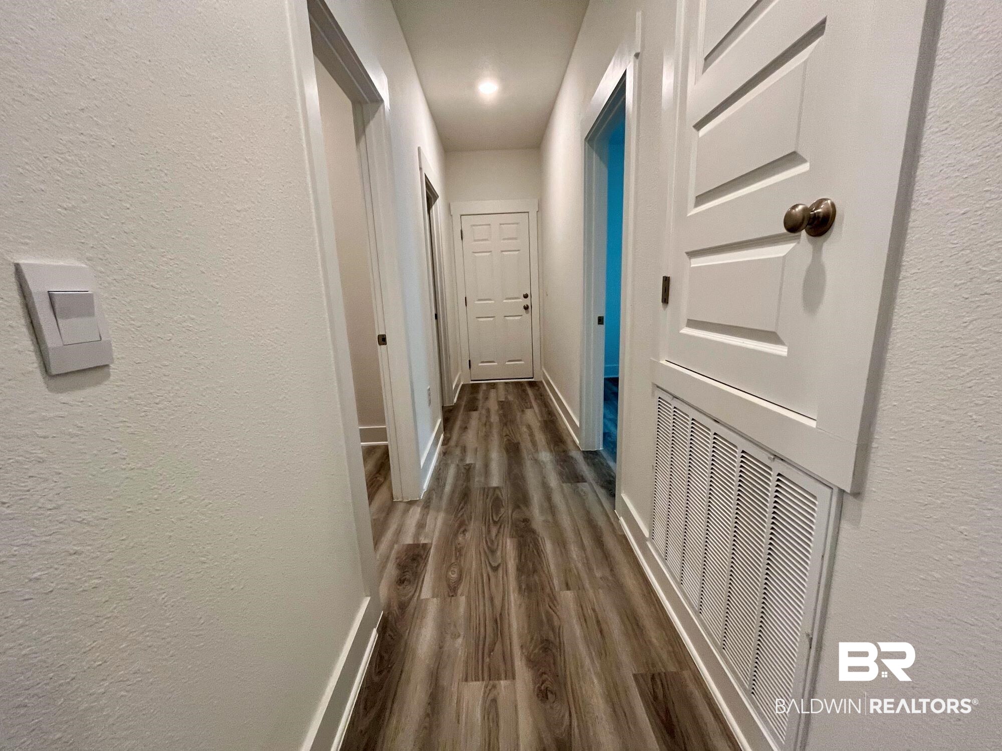 334 Barndling Street Fairhope, AL 36532 - Photo 21 of 34 Hallway with dark wood-type flooring
