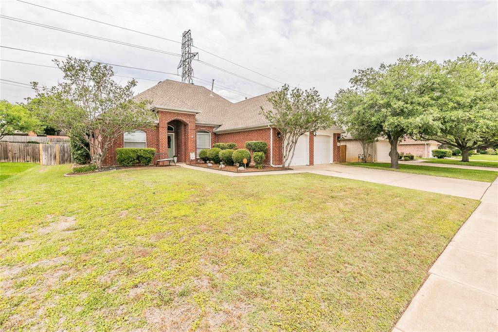 484 Shade Tree Circle Hurst, TX 76054 - Photo 1 of 1 a view of a house with a yard and potted plants