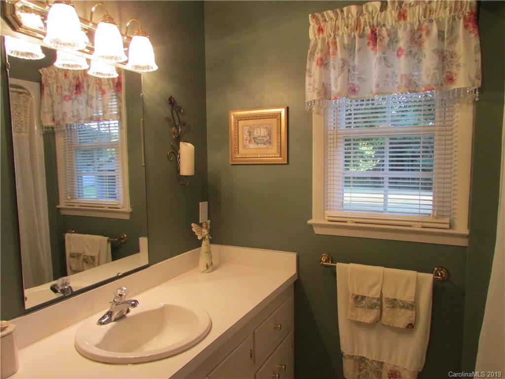 181 Sunset Drive, Unit 18A Rutherfordton, NC 28139 - Photo 4 of 10 a bathroom with a sink and a mirror