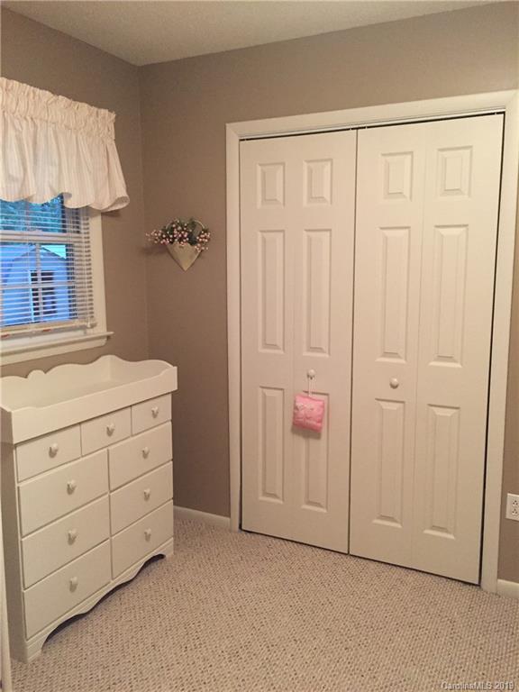 181 Sunset Drive, Unit 18A Rutherfordton, NC 28139 - Photo 7 of 10 an empty room with a wooden cabinet