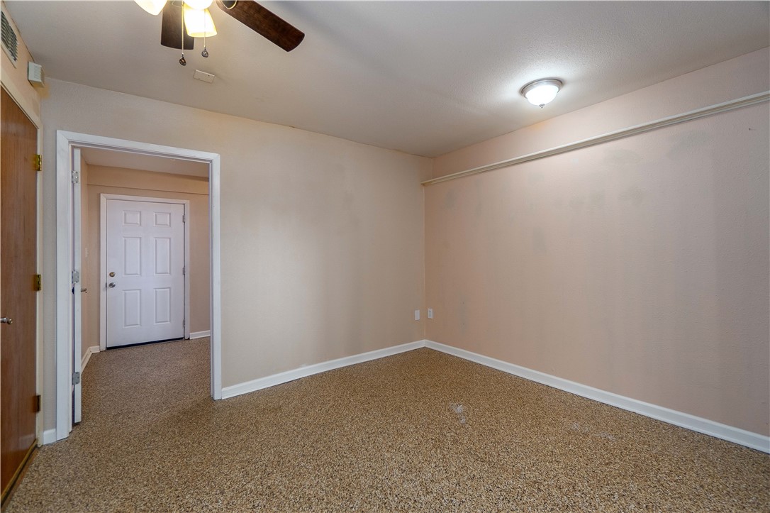 6232 Weber Road Corpus Christi, TX 78413 - Photo 8 of 23 an empty room with ceiling fan and window