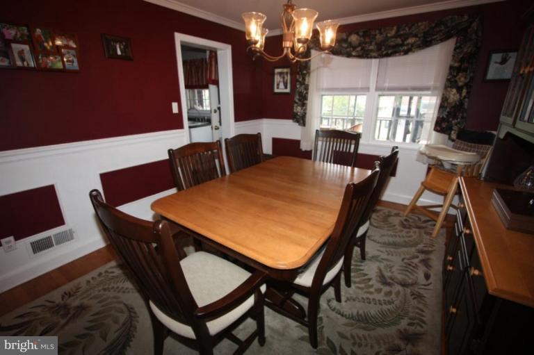 Dining Room has chair rail & painted panels below.