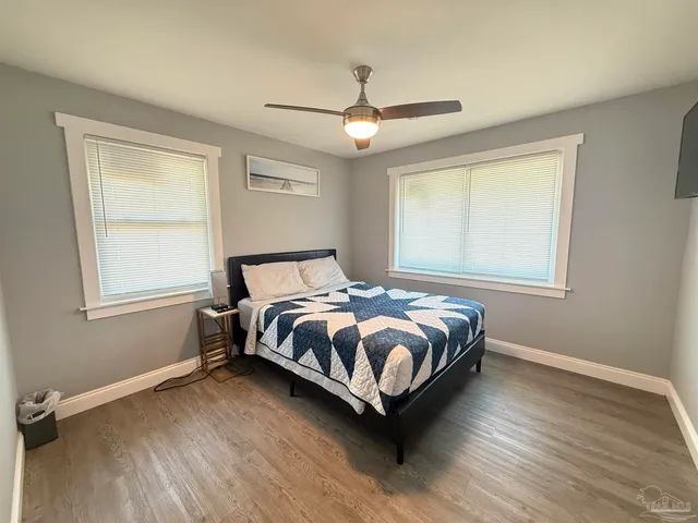 a bedroom with a bed and window