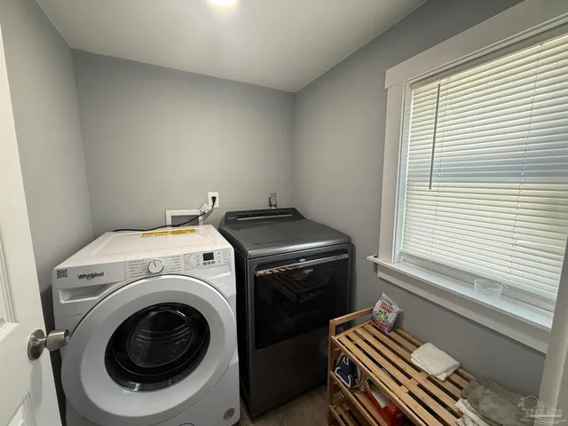 a utility room with dryer and washer