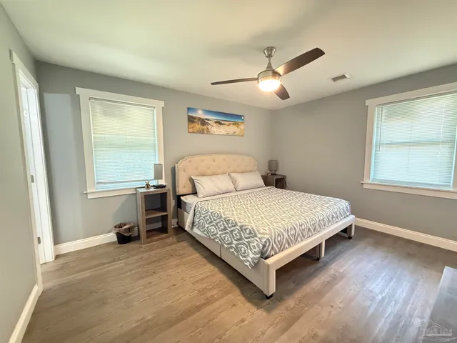a bedroom with a bed and window