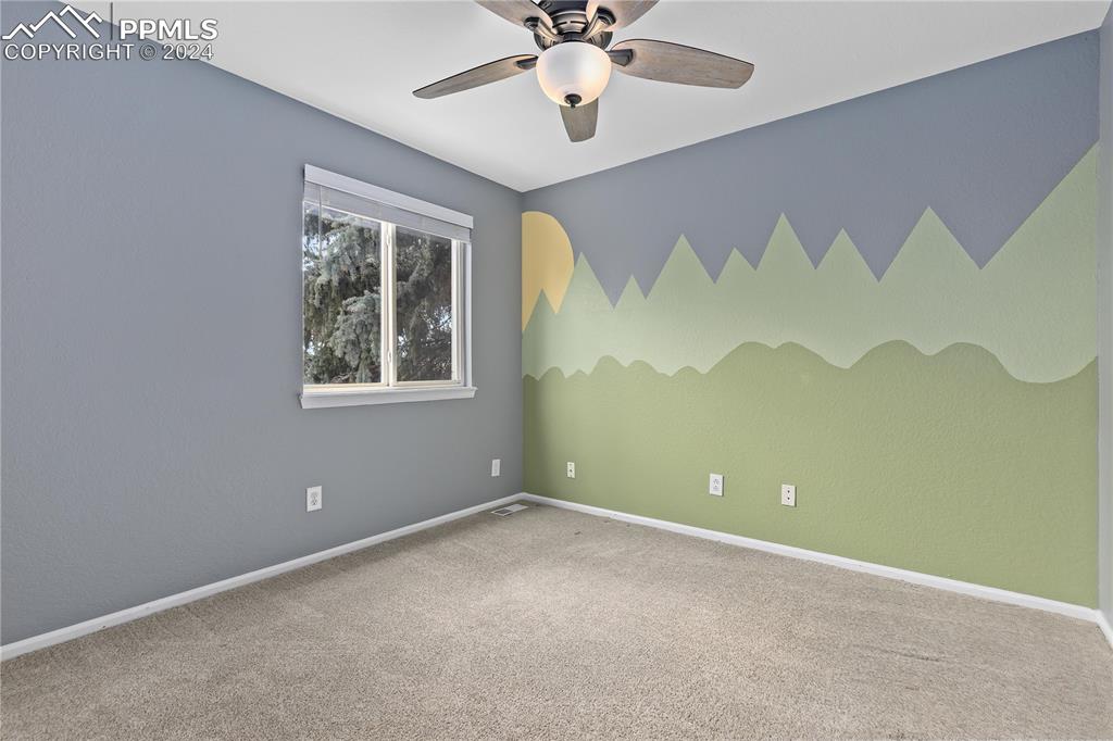 1590 Spring Water Way Highlands Ranch, CO 80129 - Photo 21 of 44 an empty room with a window and a fan