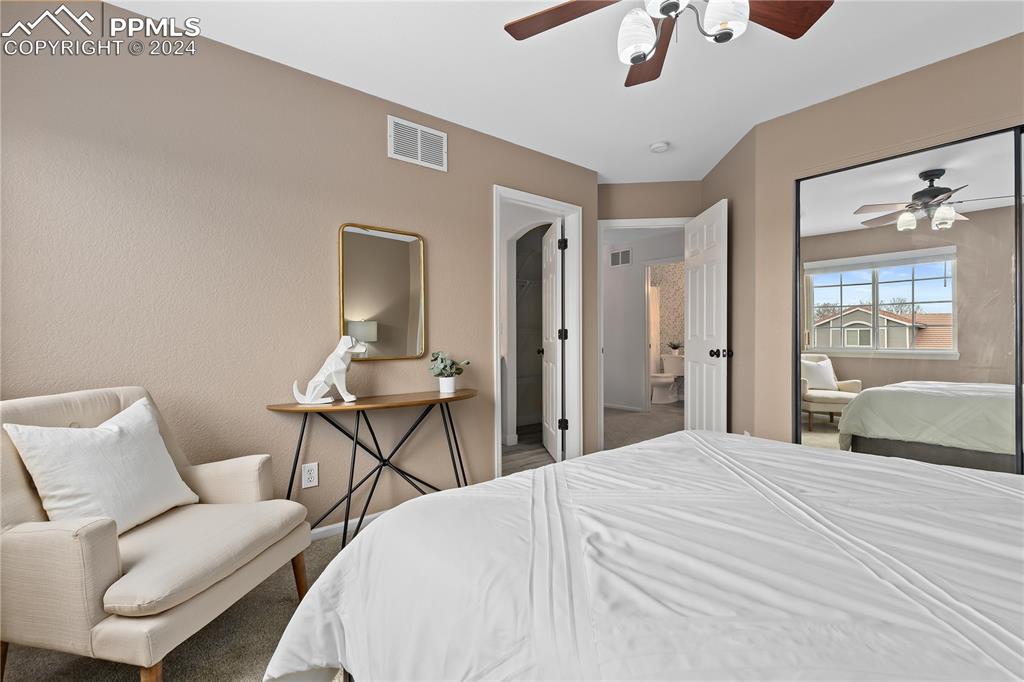 1590 Spring Water Way Highlands Ranch, CO 80129 - Photo 24 of 44 a bedroom with a bed and furniture