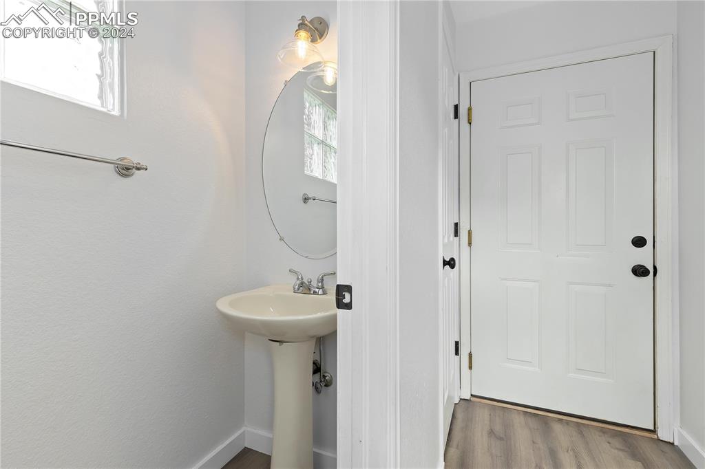 1590 Spring Water Way Highlands Ranch, CO 80129 - Photo 34 of 44 a bathroom with a sink a mirror and shower