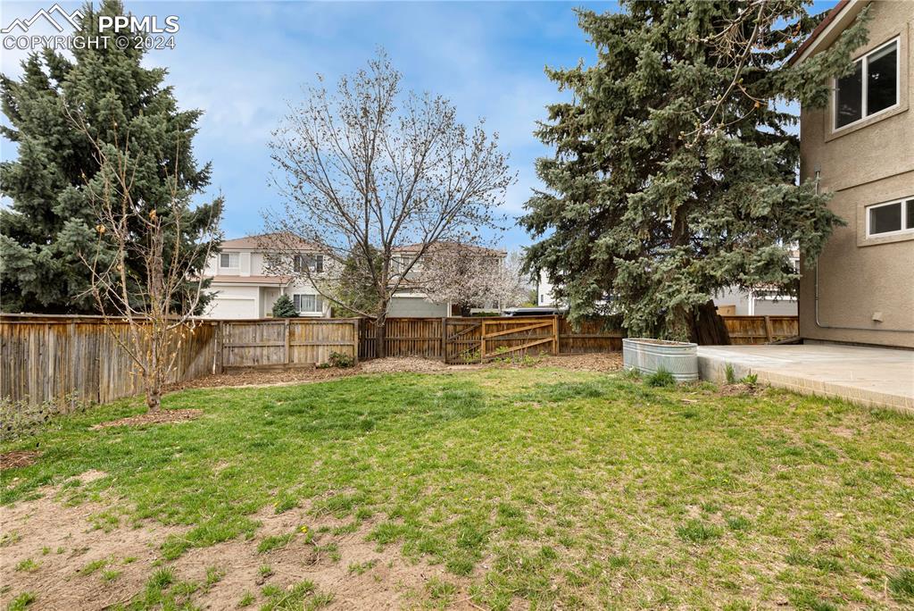 1590 Spring Water Way Highlands Ranch, CO 80129 - Photo 39 of 44 a view of a yard with a house
