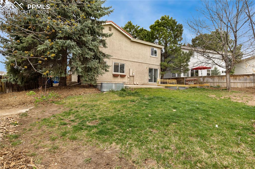 1590 Spring Water Way Highlands Ranch, CO 80129 - Photo 40 of 44 a view of a house with a yard