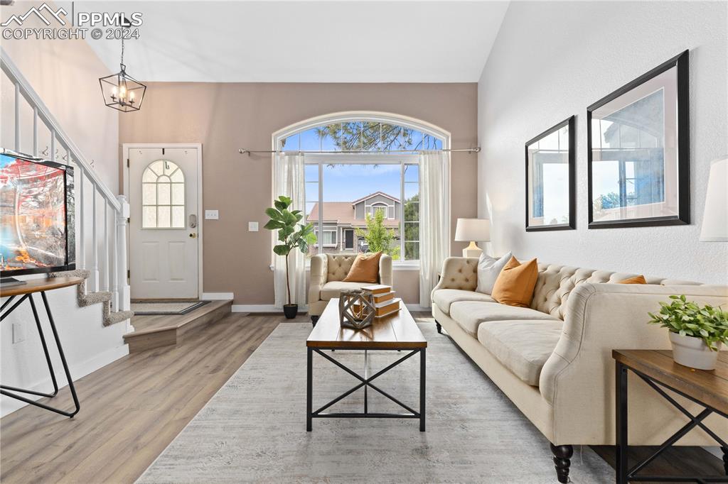 1590 Spring Water Way Highlands Ranch, CO 80129 - Photo 5 of 44 a living room with furniture and a large window