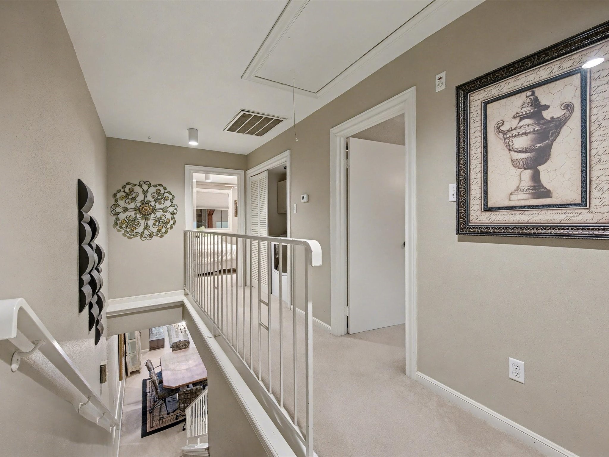 75 April Point Drive South Conroe, TX 77356 - Photo 11 of 18 a view of staircase with lots of frames on wall and couches