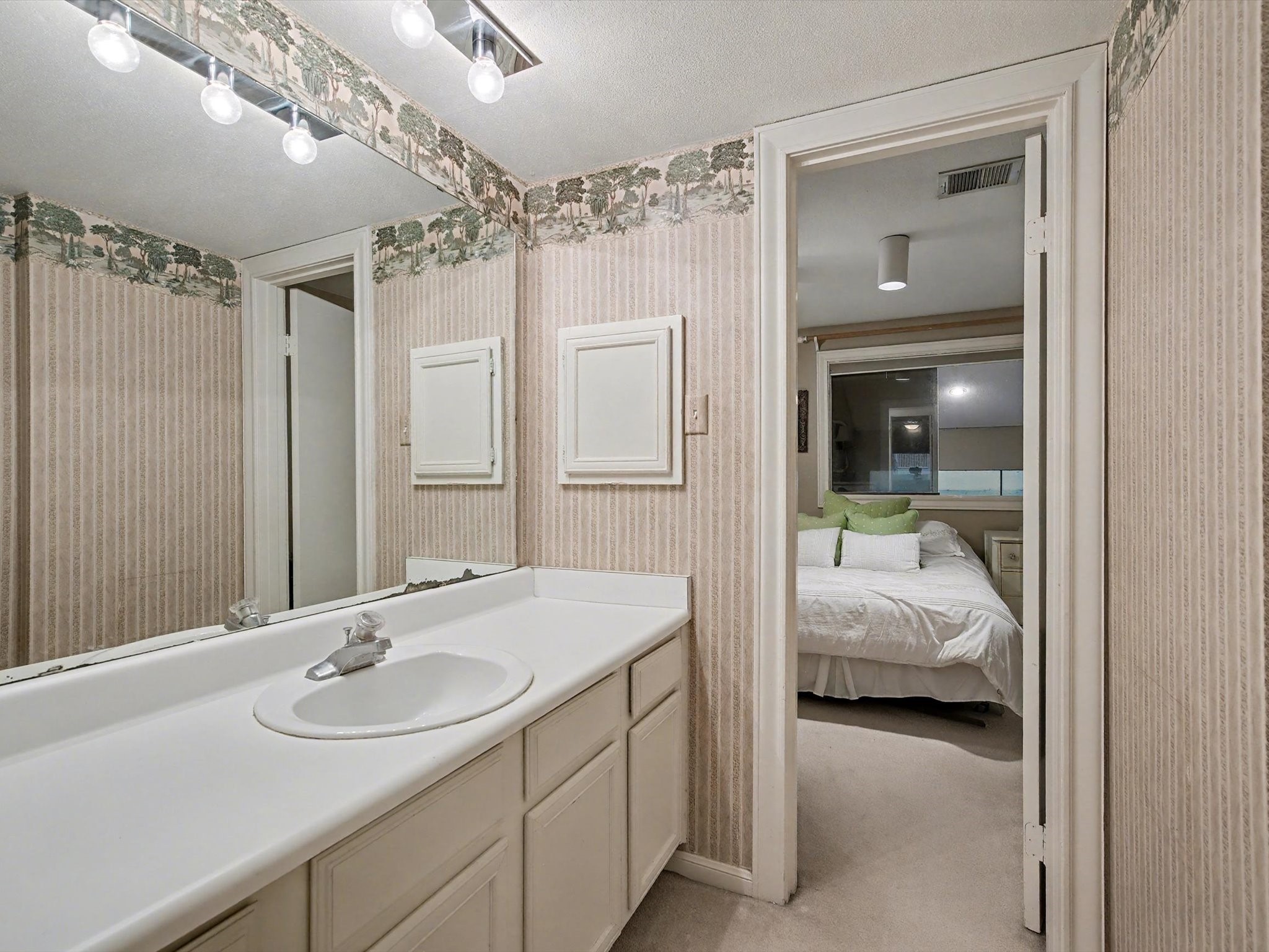 75 April Point Drive South Conroe, TX 77356 - Photo 13 of 18 a en suite bathroom with a sink double vanity and shower