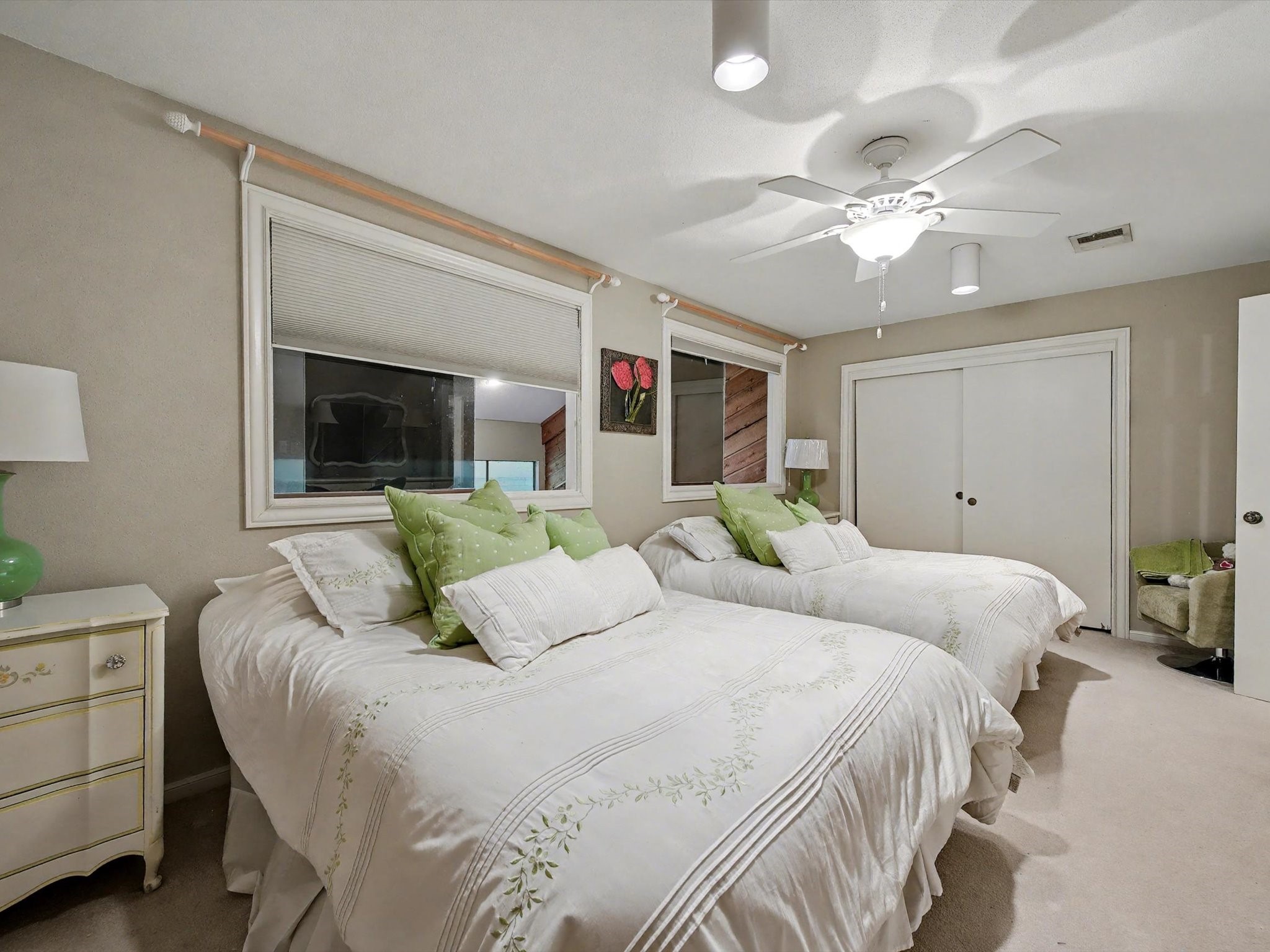 75 April Point Drive South Conroe, TX 77356 - Photo 14 of 18 a bedroom with a large bed and a chandelier