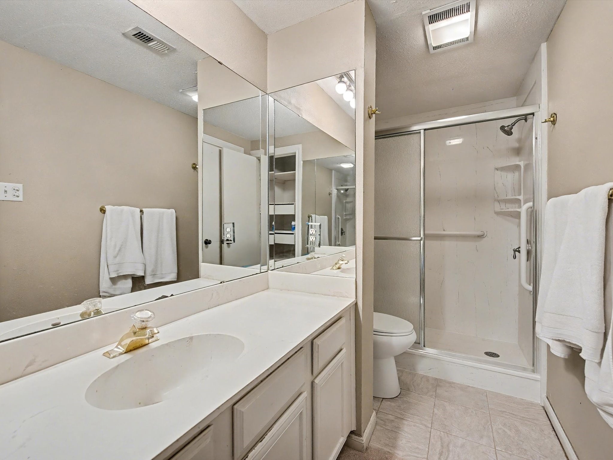 75 April Point Drive South Conroe, TX 77356 - Photo 9 of 18 a bathroom with a sink toilet double vanity and shower