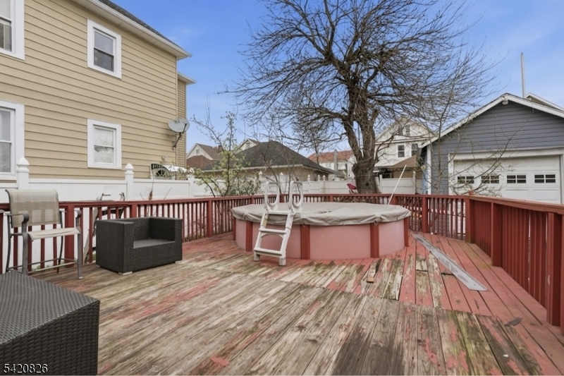 923-925 Kilsyth Road Elizabeth, NJ 07208 - Photo 23 of 24 a view of a chairs and tables in the balcony