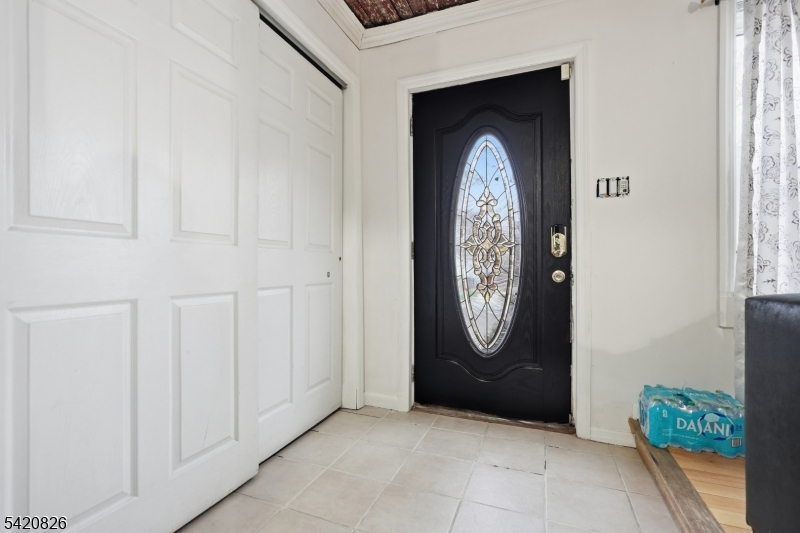 923-925 Kilsyth Road Elizabeth, NJ 07208 - Photo 5 of 24 a front view of a house with entryway